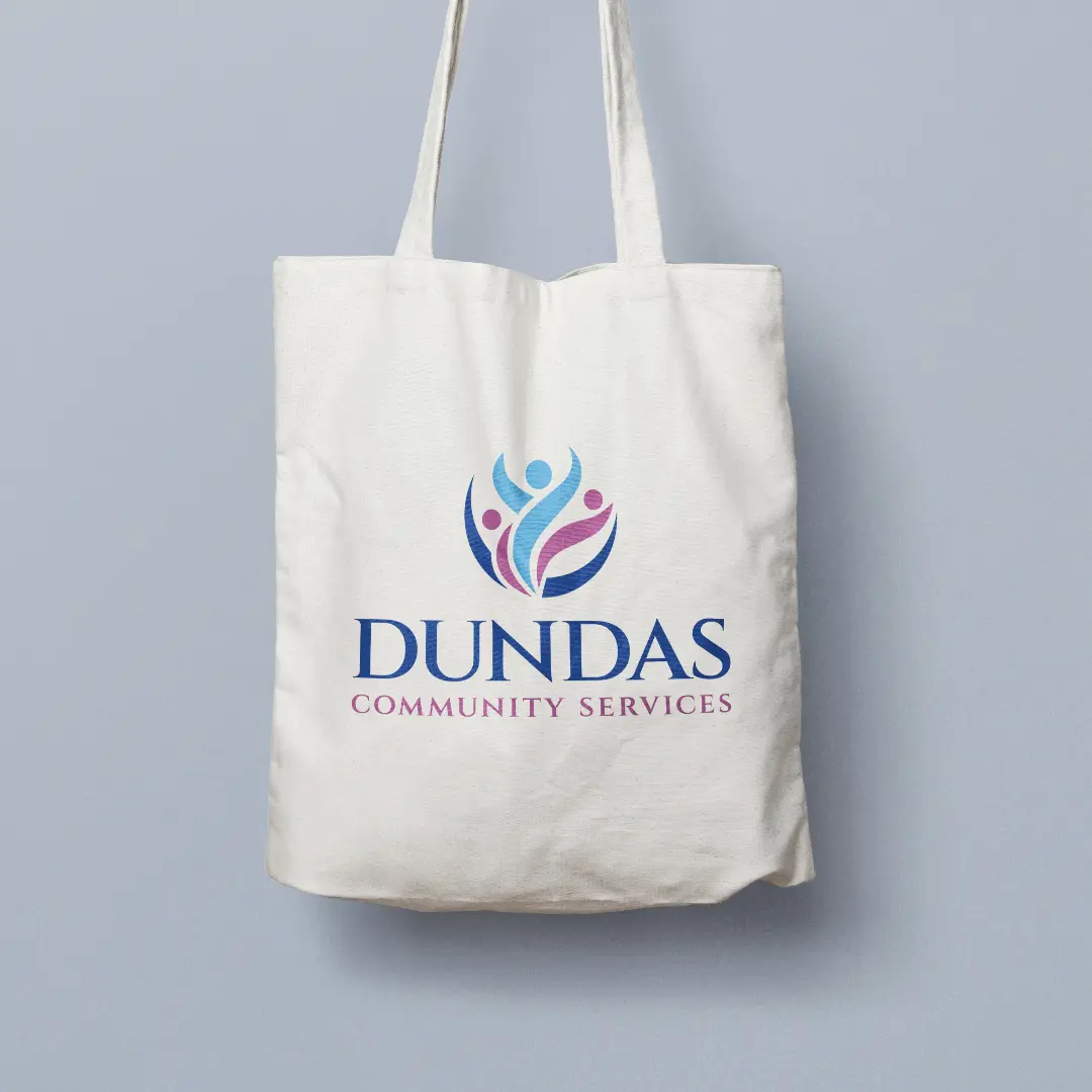 An image of a logo of Dundas Community Services on a tote bag